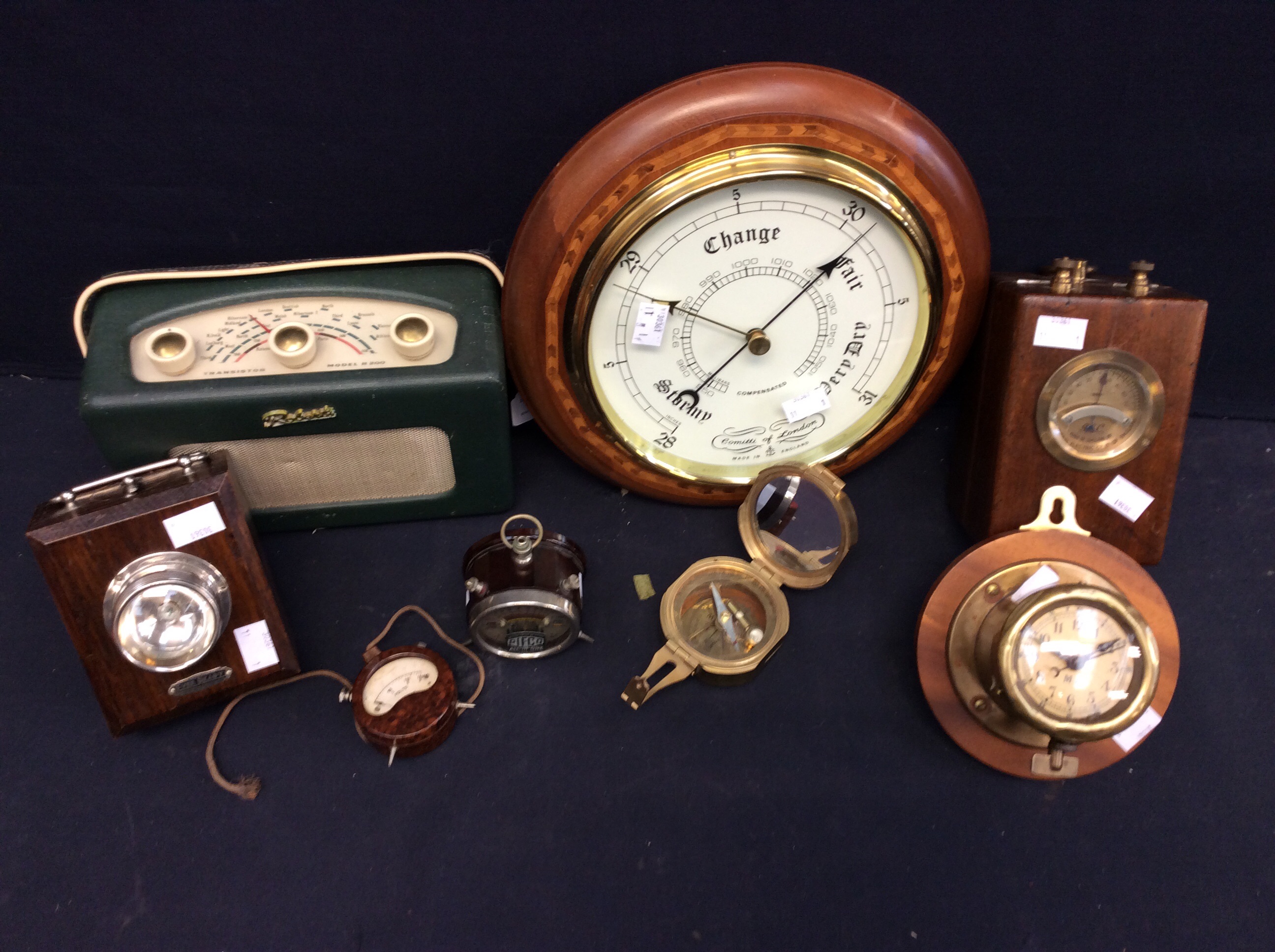 A late 20th Century reproduction round wall barometer, a mid 20th Century oak ever ready lamp, two