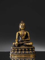 A LARGE SILVER AND COPPER INLAID BRONZE FIGURE OF SHAKYAMUNI BUDDHA, TIBET, 15TH CENTURY