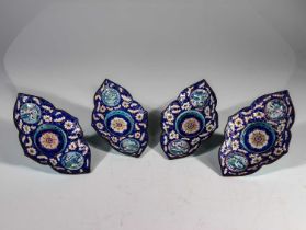 FOUR LOTUS SHAPED DISHES