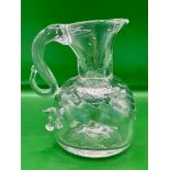 A very rare late Tudor early Georgian hand blown swirl jug with finger stop allowing for easier pour