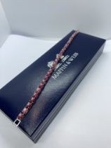 APPROX 6.25ct CABOCHON RUBY TENNIS BRACELET SET IN WHITE METAL