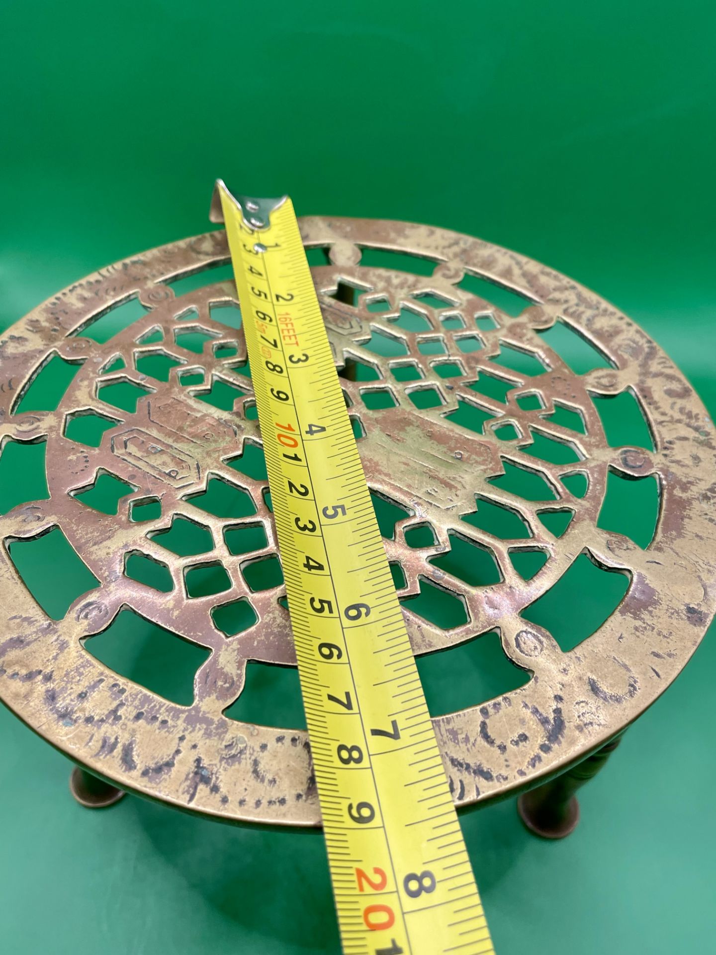 Antique Edwardian Brass Trivet. Having a circular pierced engraved top, raised on three turned brass - Image 3 of 3