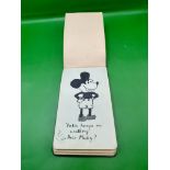 A 1930s Autograph book with some classic drawings from Felix the Cat to Mickey Mouse a very interest