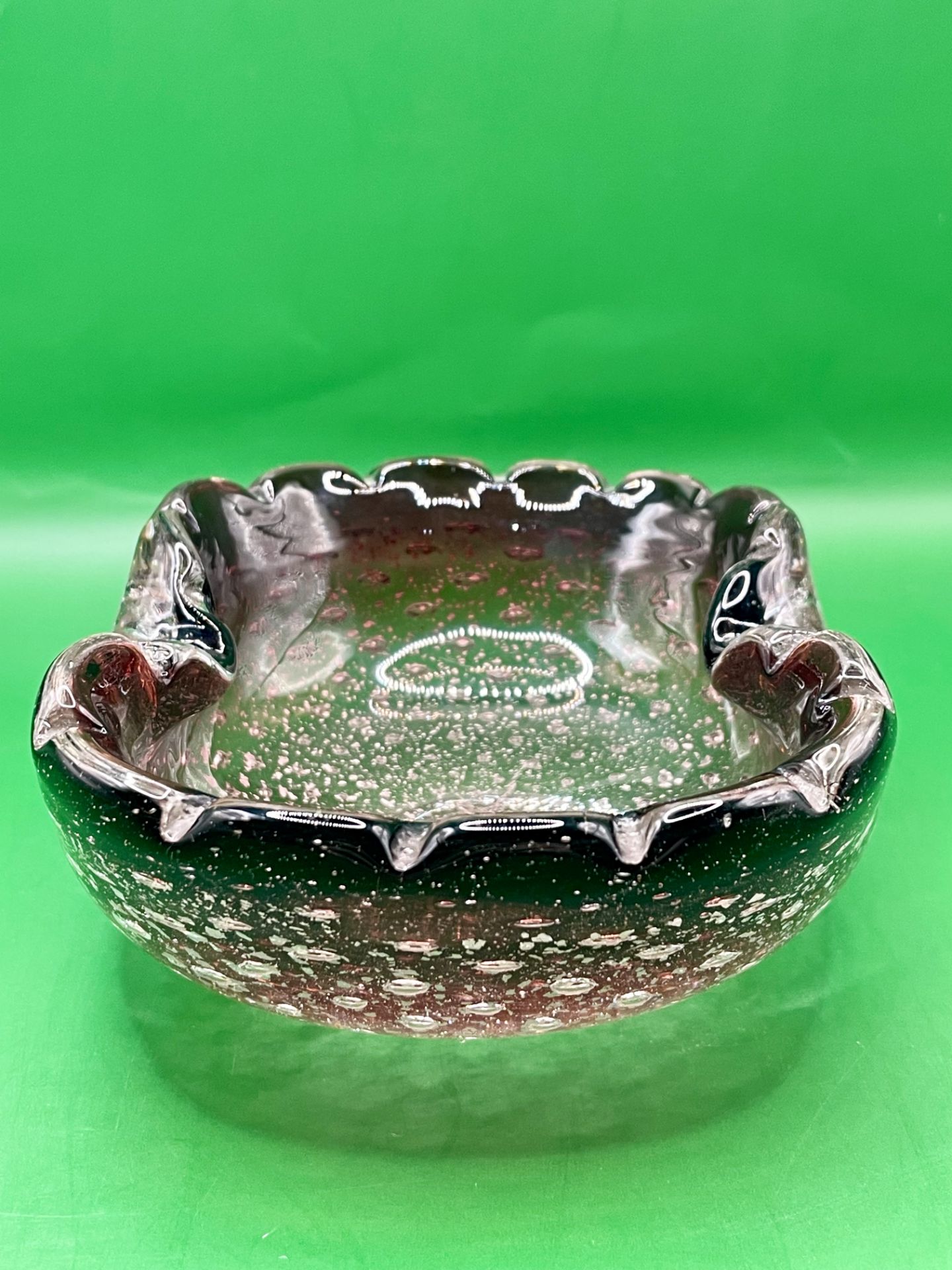 A 1960s Murano glass oyster dish/ashtray with controlled blown bubbles and silver flake inside a sor