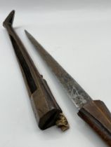 A very old Possibly African dagger in wooden sheath.