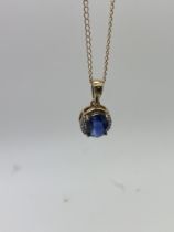 9ct GOLD SAPPHIRE PENDANT AND CHAIN APPROX. 17' LE