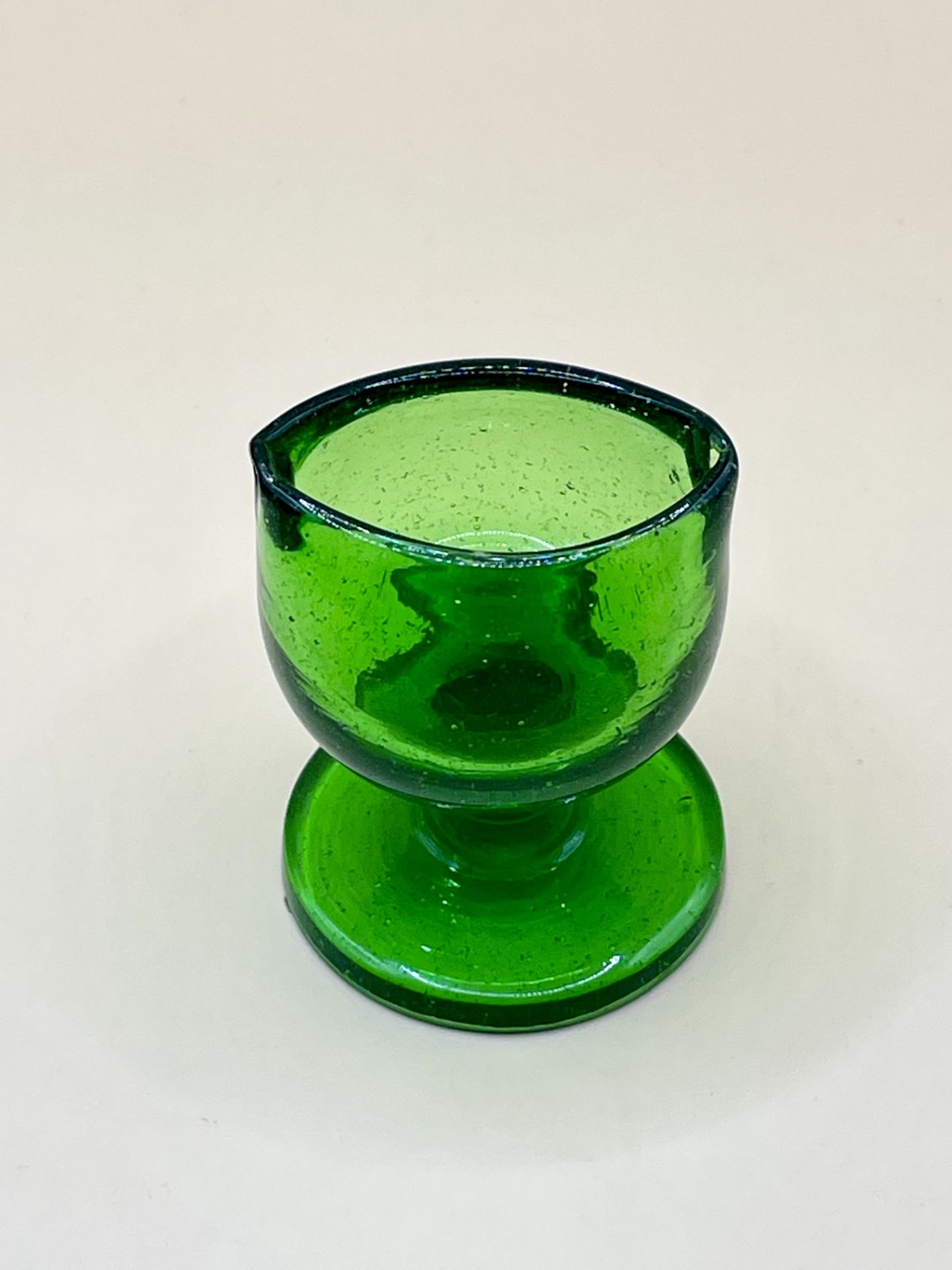 A Victorian Green glass eye bath great condition. 