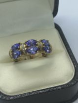 9ct YELLOW GOLD 2.00ct TANZANITE AND DIAMOND RING APPROX. RING SIZE N AND WEIGHT 5.15g