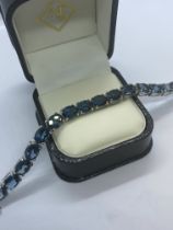 10ct BLUE TOPAZ BRACELET SET IN WHITE METAL APPROX. 8' LONG