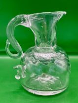 A very rare late Tudor early Georgian hand blown swirl jug with finger stop allowing for easier pour