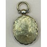 A Victorian gold coloured locket which opens on both sides very well made please see photos for bett