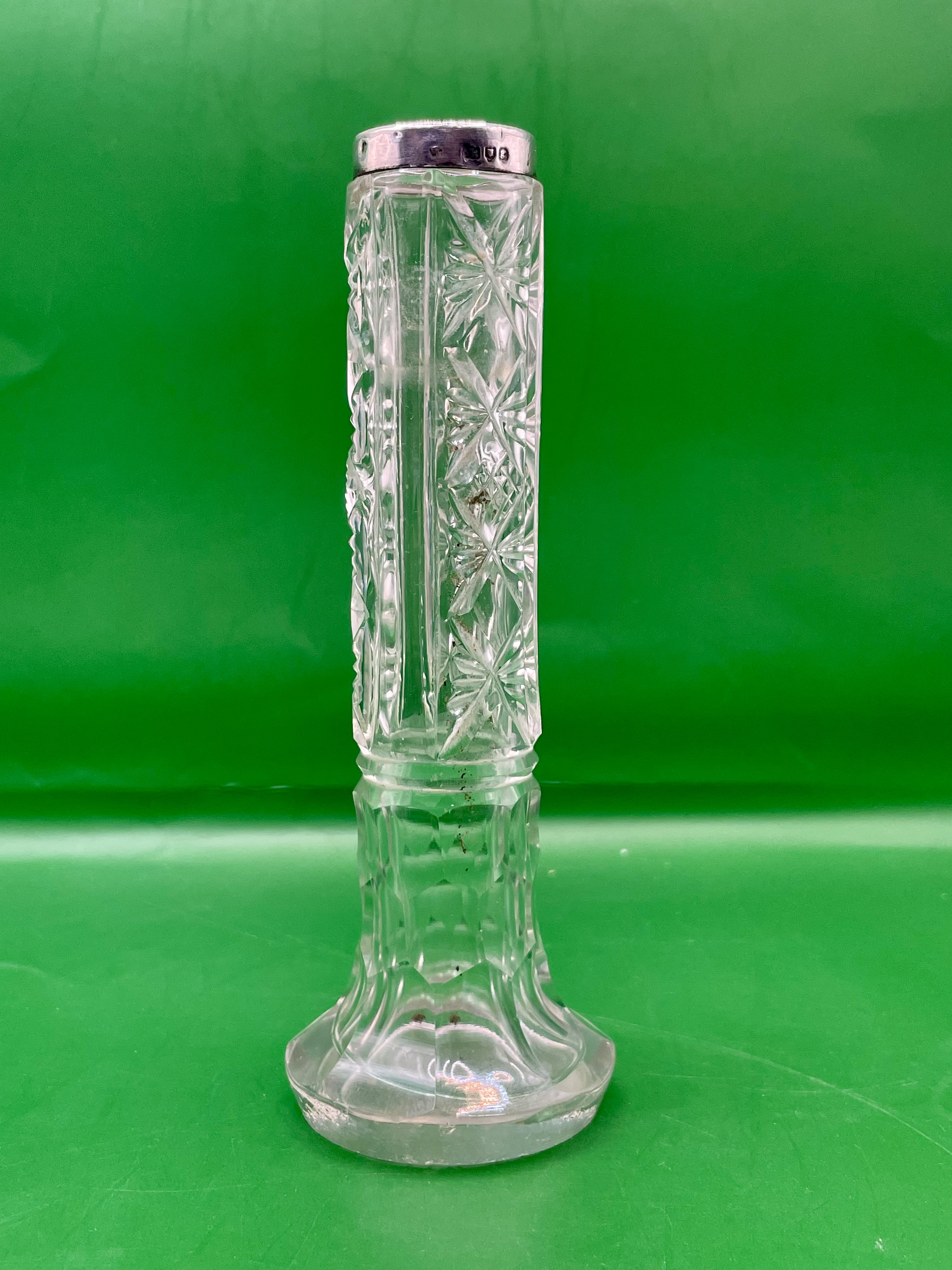 A small Georgian Cutt Glass posey vase with silver hallmarked trim Chester mark. Letter (g)