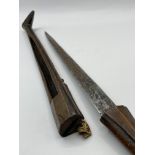 A very old Possibly African dagger in wooden sheath.