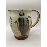 Lovely studio pottery jug with great art on side.