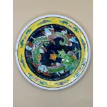 An Antique Asian possibly Japanese Early 20th century enamelled plate on porcelain. Decorated with d