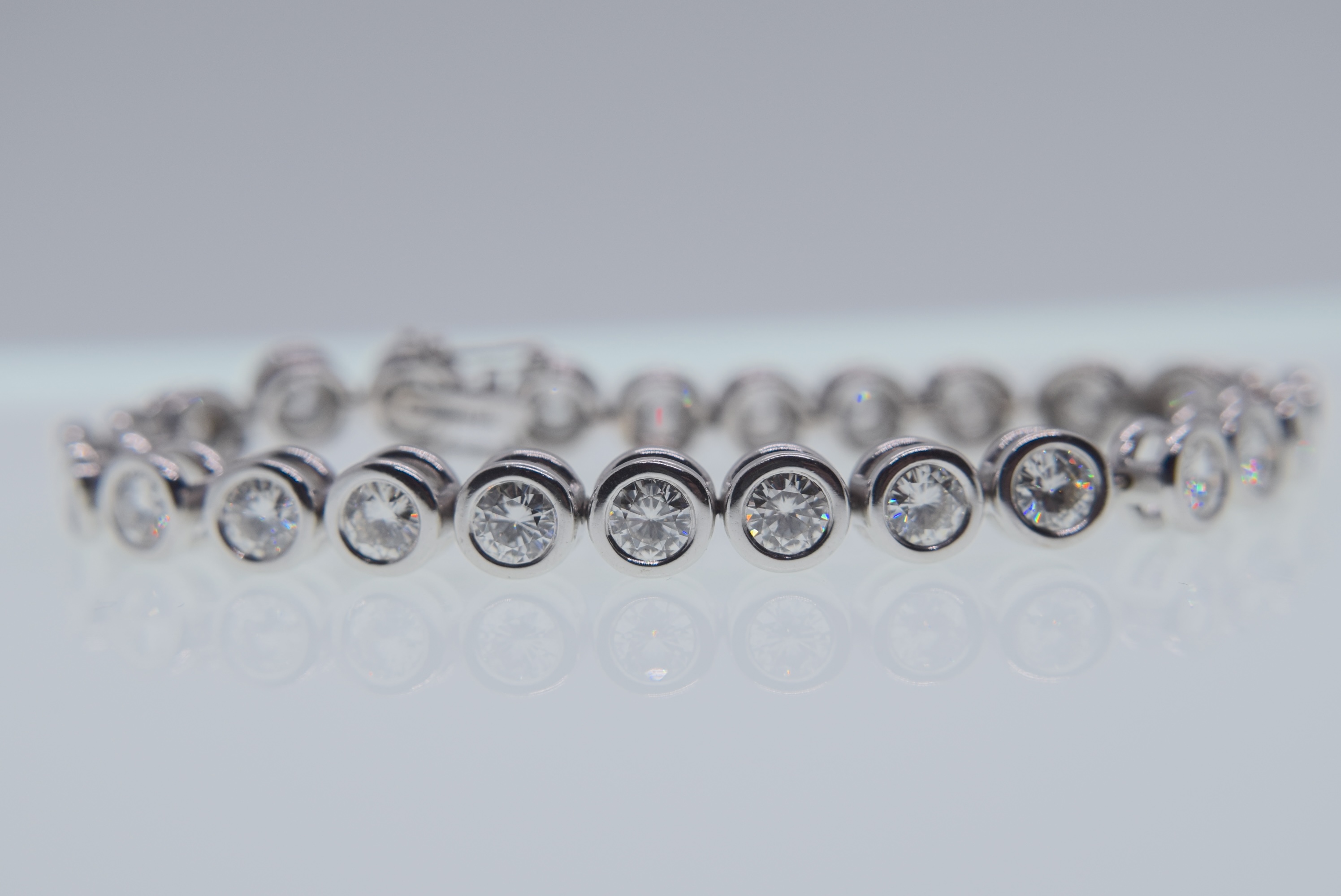 18K WHITE GOLD TENNIS BRACELET (APPROX. 18.00CT MOISSANITES) - WEIGHT: 32 GRAMS