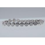 18K WHITE GOLD TENNIS BRACELET (APPROX. 18.00CT MOISSANITES) - WEIGHT: 32 GRAMS