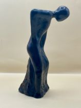 1920s resin sculpture of bent over lady.