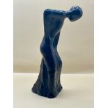 1920s resin sculpture of bent over lady.