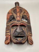 A wooden vintage hand carved African face mask. Great condition.