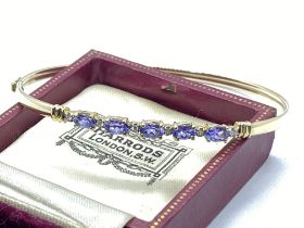 14ct YELLOW GOLD TANZANITE AND DIAMOND BANGLE WITH OPENING CLASP