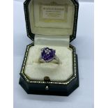 PRETTY AMETHYST RING SET IN SILVER METAL APPROX. RING SIZE N 1/2