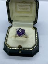 PRETTY AMETHYST RING SET IN SILVER METAL APPROX. RING SIZE N 1/2