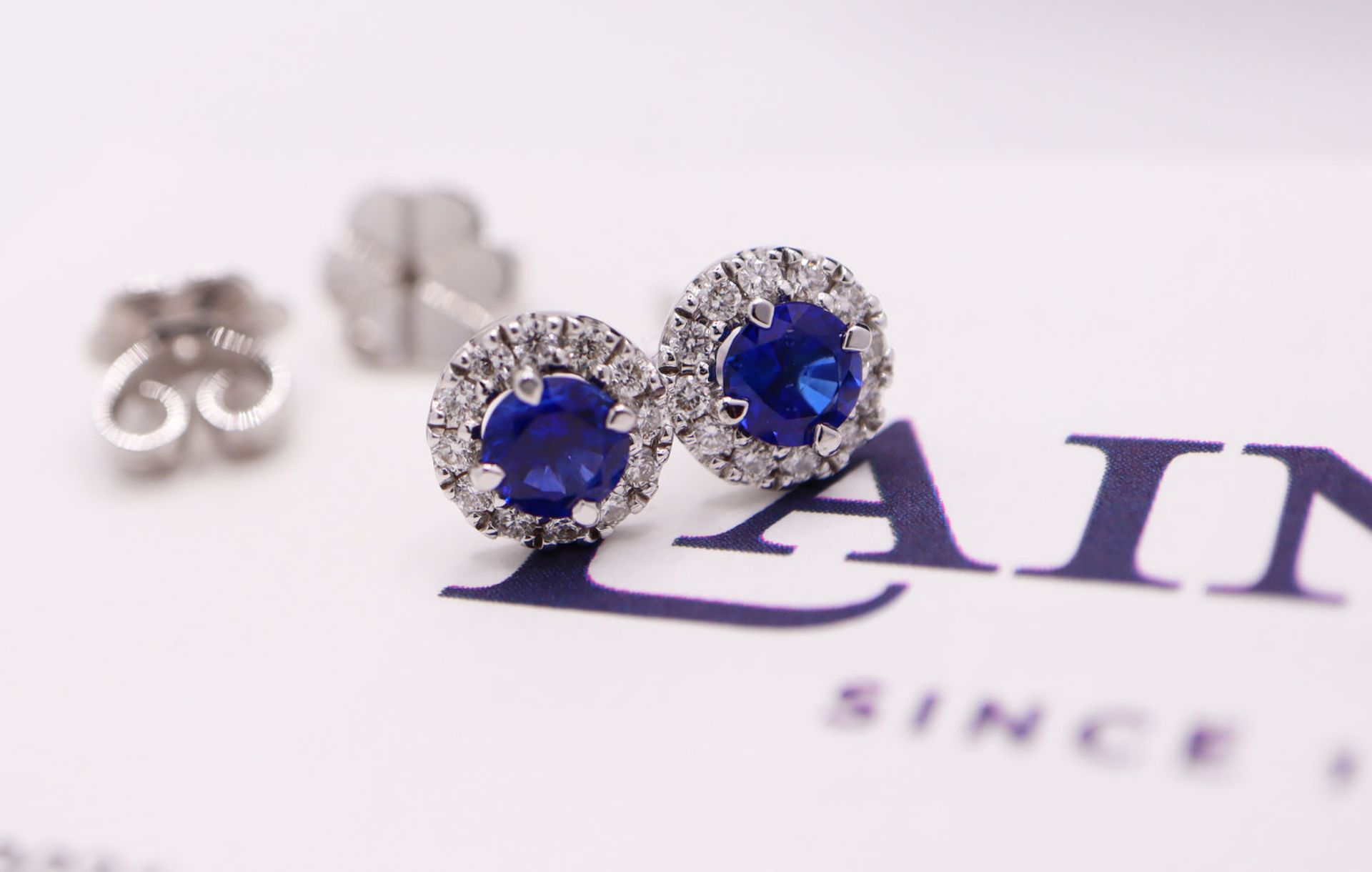 18K WHITE GOLD - 1.01CT SAPPHIRE & DIAMOND STUD EARRINGS; with LAINGS Original Receipt / Certificate - Image 8 of 8