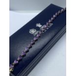 AMETHYST SET TENNIS BRACELET SET IN WHITE METAL - APPROX 7" LONG