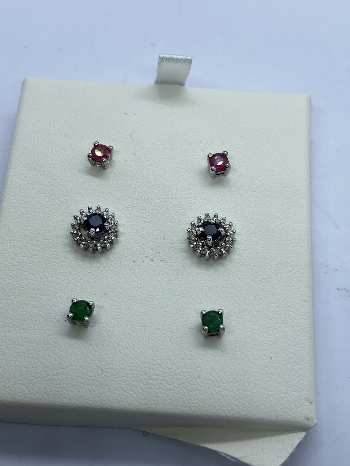 BLUE SAPPHIRE, RUBY, EMERALD AND DIAMOND INTERCHANGEABLE EARRINGS SET IN WHITE METAL - Image 2 of 3
