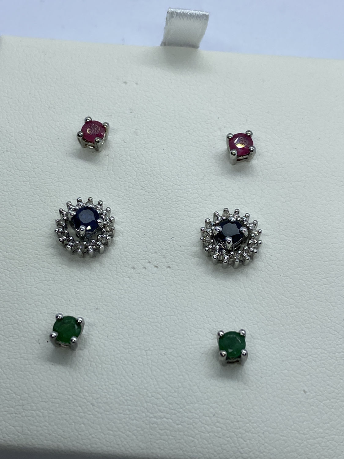 BLUE SAPPHIRE, RUBY, EMERALD AND DIAMOND INTERCHANGEABLE EARRINGS SET IN WHITE METAL
