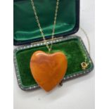9ct GOLD BALTIC HEART SHAPEDAMBER PENDANT 1.2' X 1.2' AND CHAIN APPROX. LENGTH 16'