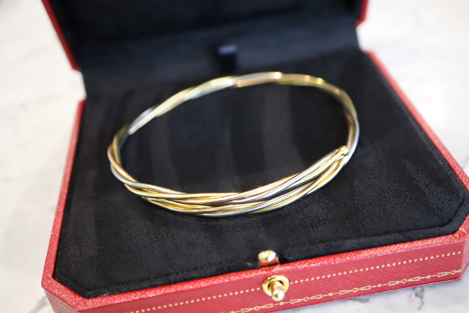18K TRINITY GOLD BANGLE (YELLOW, WHITE & ROSE GOLD) - SIGNED 'CARTIER'