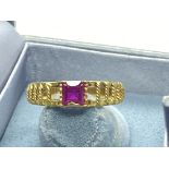 RUBY SET RING IN YELLOW METAL TESTED AS 18CT GOLD