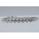 18K WHITE GOLD TENNIS BRACELET (APPROX. 18.00CT MOISSANITES) - WEIGHT: 32 GRAMS