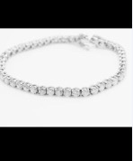 18ct GOLD 9.00ct DIAMOND TENNIS BRACELET - APPROX SI1/SI2 CLARITY & G/H COLOUR - 7" LONG