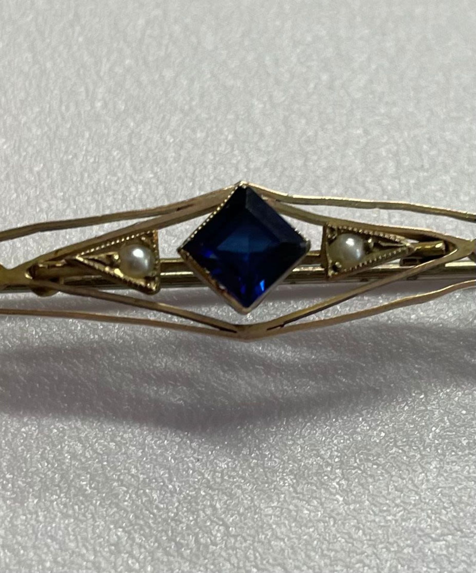 Edwardian pin with sapphire and pearls. The sapphire has come out. Market 9ct