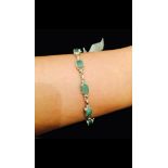 14CT WHITE GOLD 5.50CT EMERALD TENNIS BRACELET - $2813 VALUATION