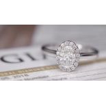 GIA DIAMOND PLATINUM HALO OVAL RING - WITH GIA DIAMOND DOSSIER CERT/ £4,995.00 VALUATION & BOX