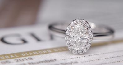 GIA DIAMOND PLATINUM HALO OVAL RING - WITH GIA DIAMOND DOSSIER CERT/ £4,995.00 VALUATION & BOX