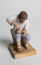 POPOV’S PORCELAIN SCULPTURE ‘A PEASANT MAN WEAVING LAPTI’ Moscow, Gorbunovo, A.G. Popov's Factory, c