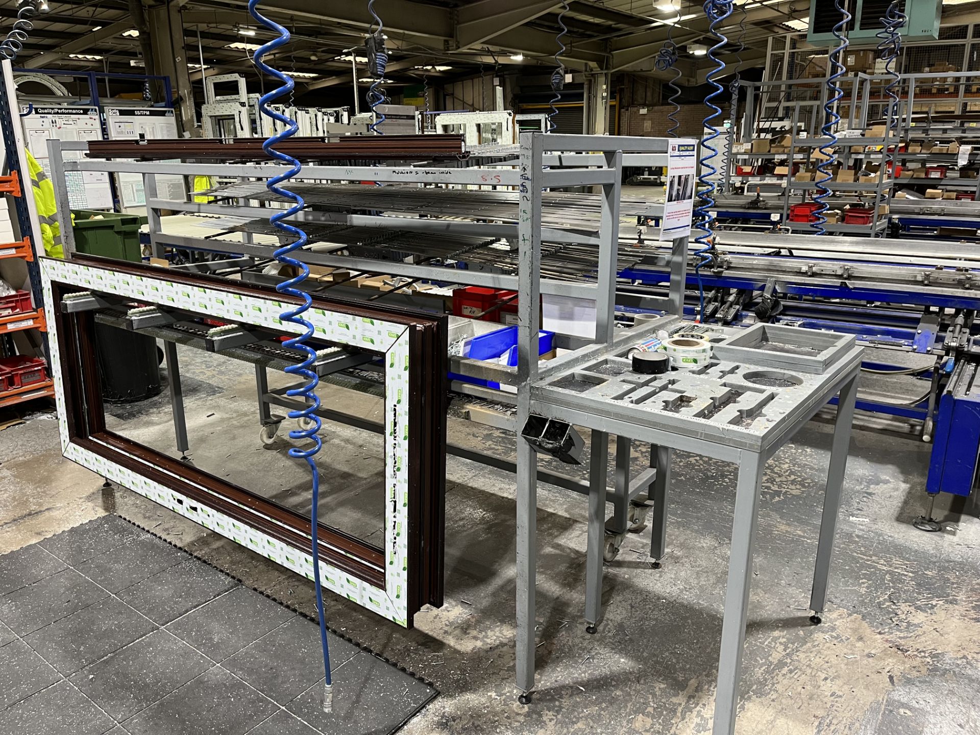 3, Steel fabricated uPVC door frame assembly benches. Components fed from rear with further location