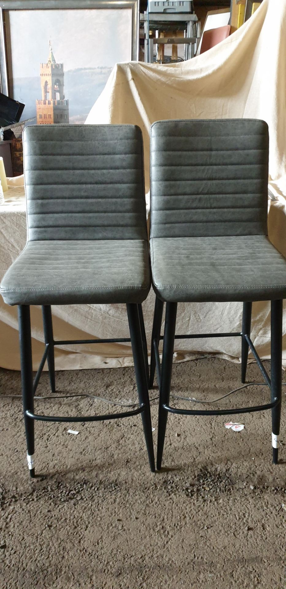 14 ; Grey upholstered, black metal based bar stools