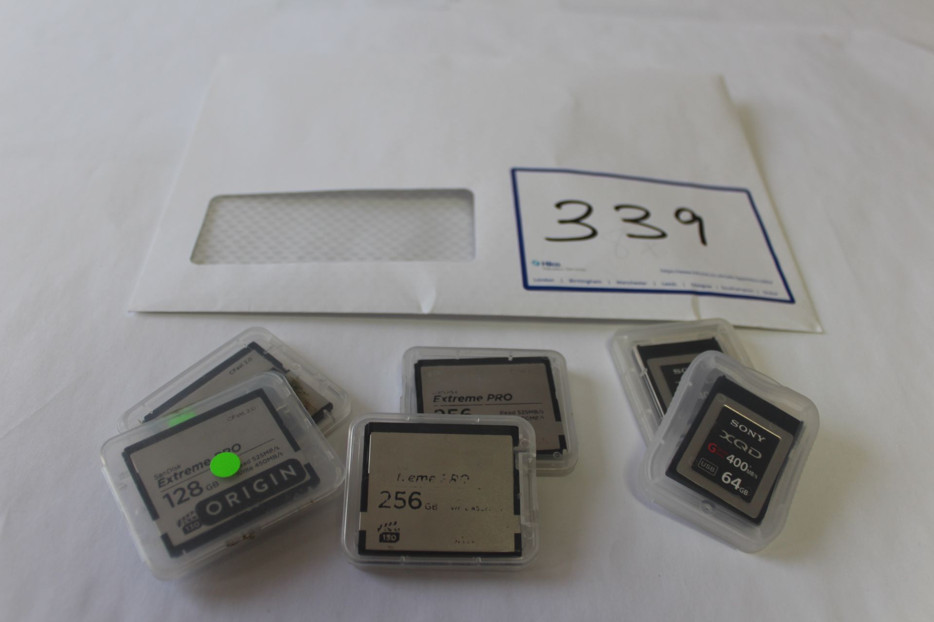 2 Sony XQD 64GB Memory Cards, 2 Sandisk Extreme Pro 256Gb Memory Cards and 2 Sandisk Extreme Pro 128