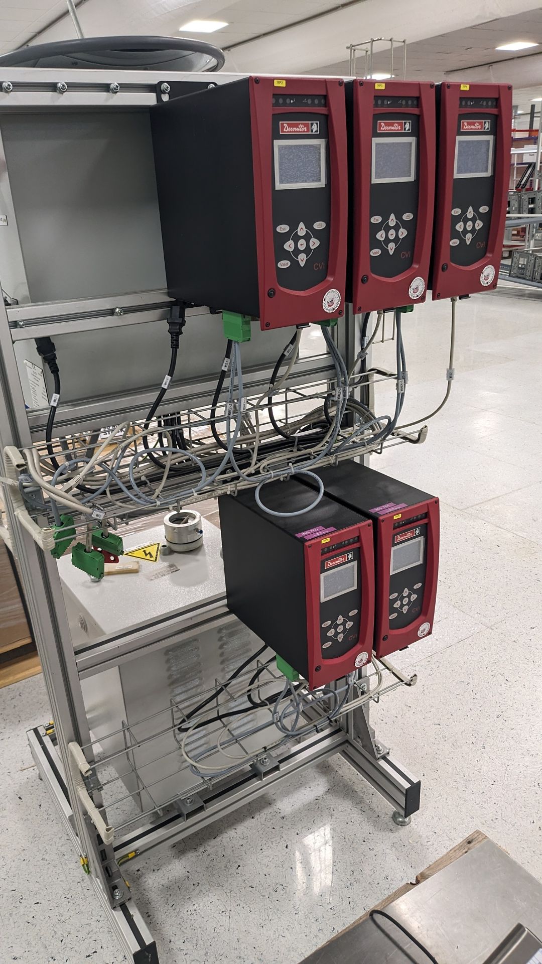 Rig containing 5 Desoutter CVI units and 2 transformers and a box of 5: Desoutter drivers as lotted
