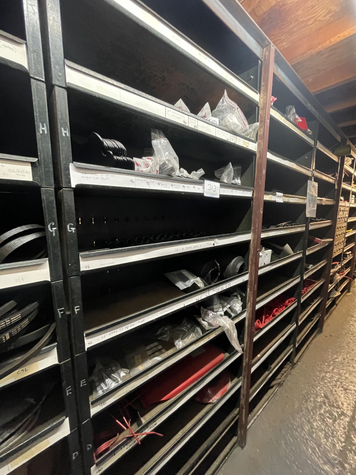 Contents of 3 Racks to Include Various LELY Tines, Skid Plates & Mower Blades As Lotted