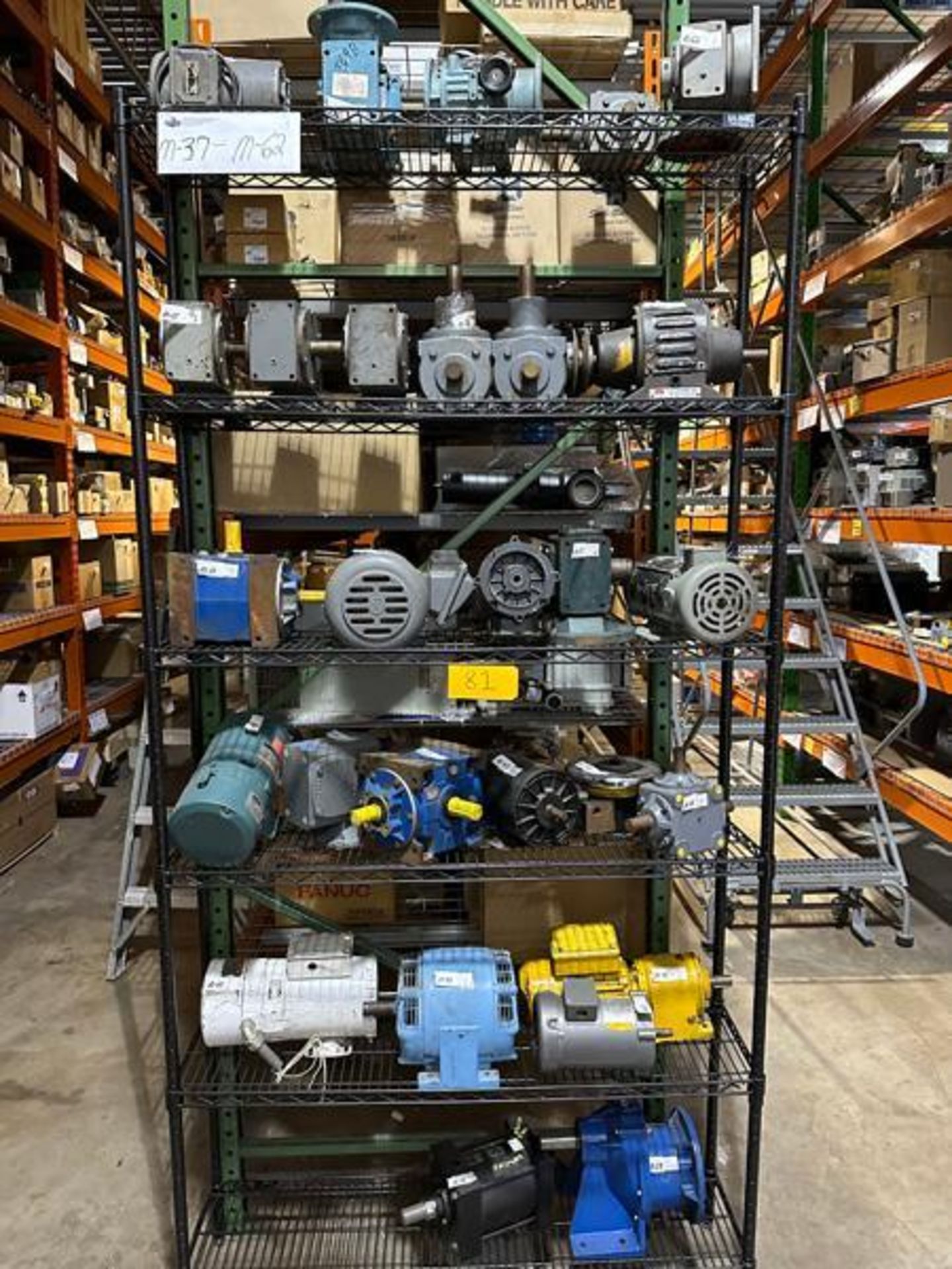 Six Shelves Of Various Motors And Gearboxes