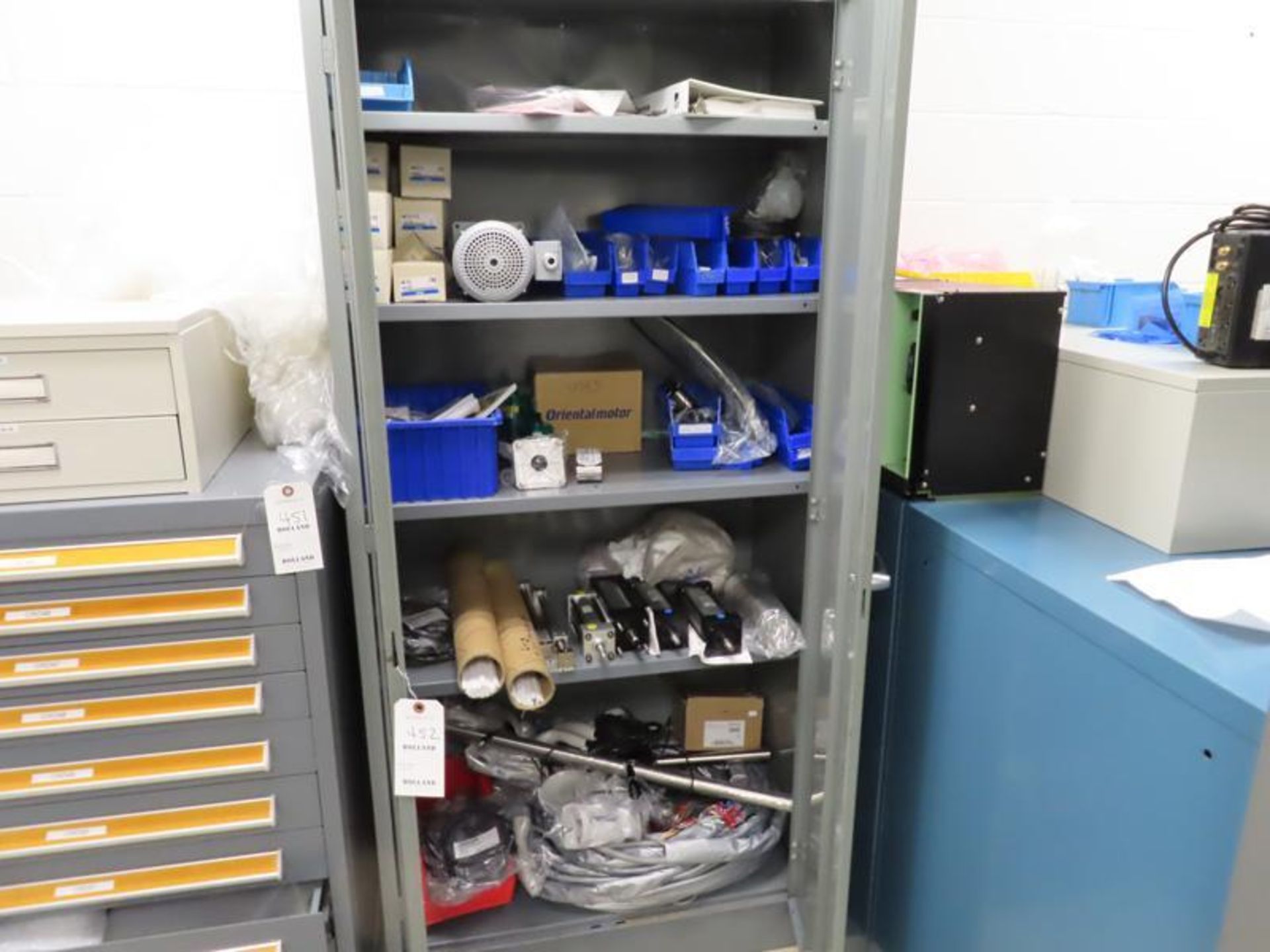 Metal Storage Cabinet & Contents including 1/2hp single phase motor, oriental moto, cylinders, and o