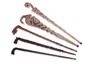 A GROUP OF FIVE DRAGON WALKING STICKS