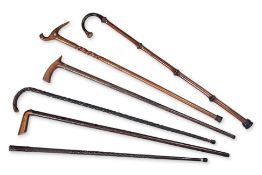 A GROUP OF SIX ASSORTED WALKING STICKS